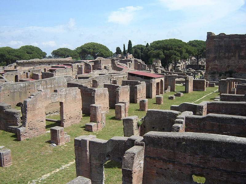 A marble head pops up from the Ostia Antica Archaeological Park