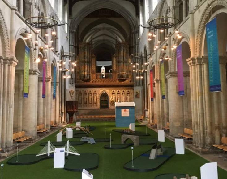 England, Rochester Cathedral hosts a miniature golf course inside for a month