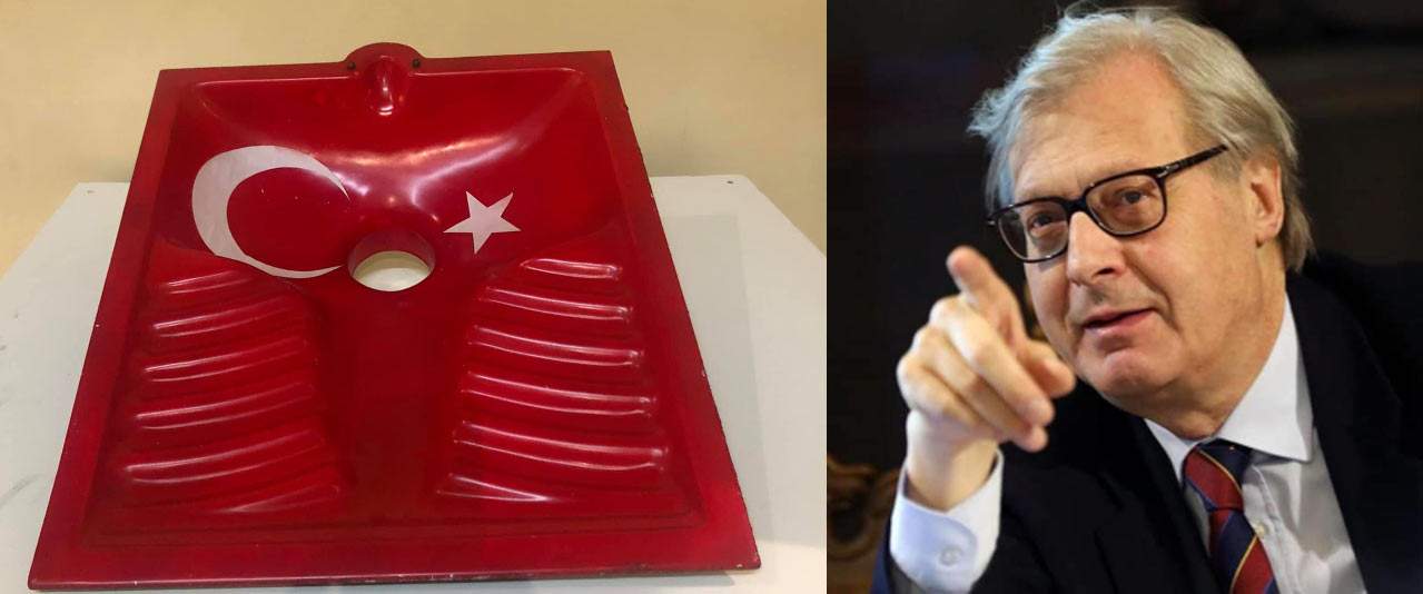 Minacce e insulti a Sgarbi per un'opera della sua mostra: un bagno alla turca con bandiera