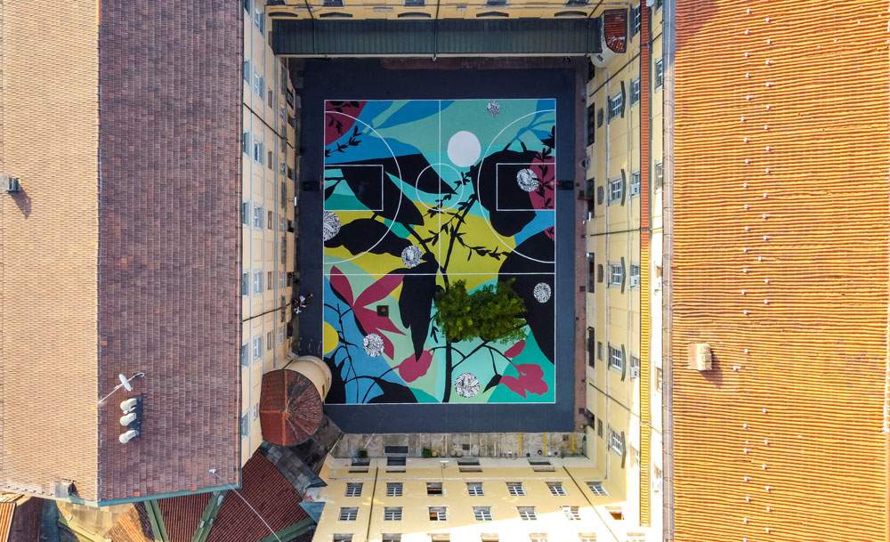 Street art, Turin's former Military Academy becomes a flowery basketball court