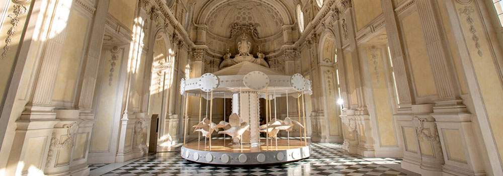 A large merry-go-round in the Reggia di Venaria: it's Valerio Berruti's installation