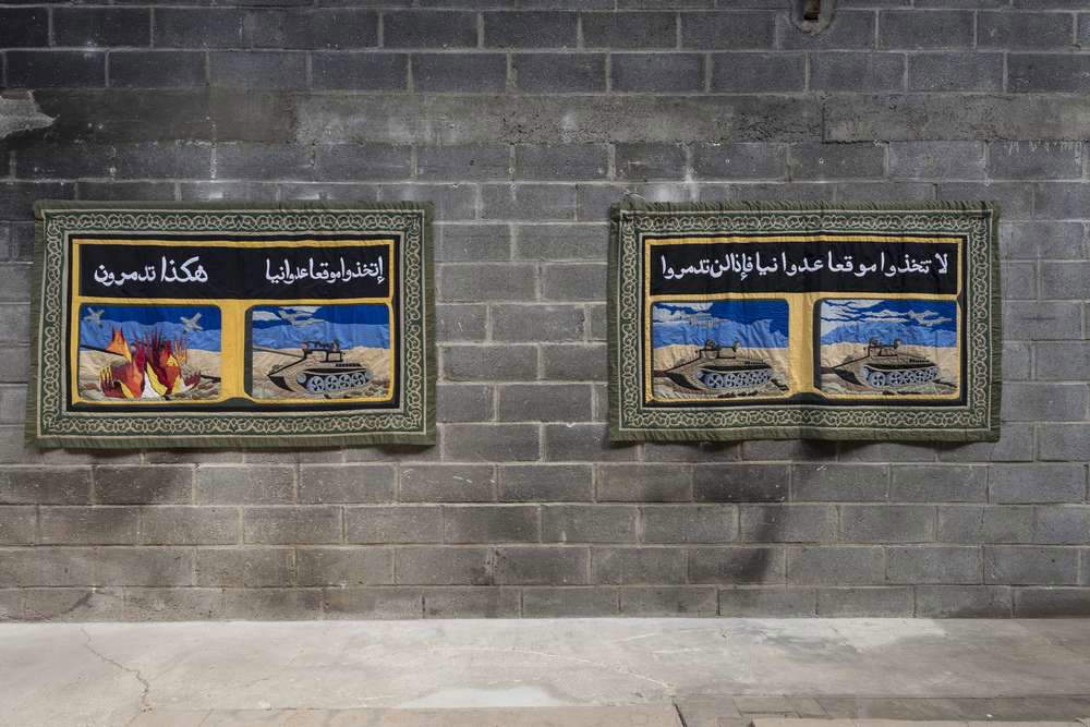 Moataz Nasr, Propaganda (Don't take an attack position or you will be destroyed) and Propaganda (Take an attack position and that's how you will be destroyed!!) (2008; fabric diptych, 125 x 208 each). Ph. Credit Oak Taylor-Smith