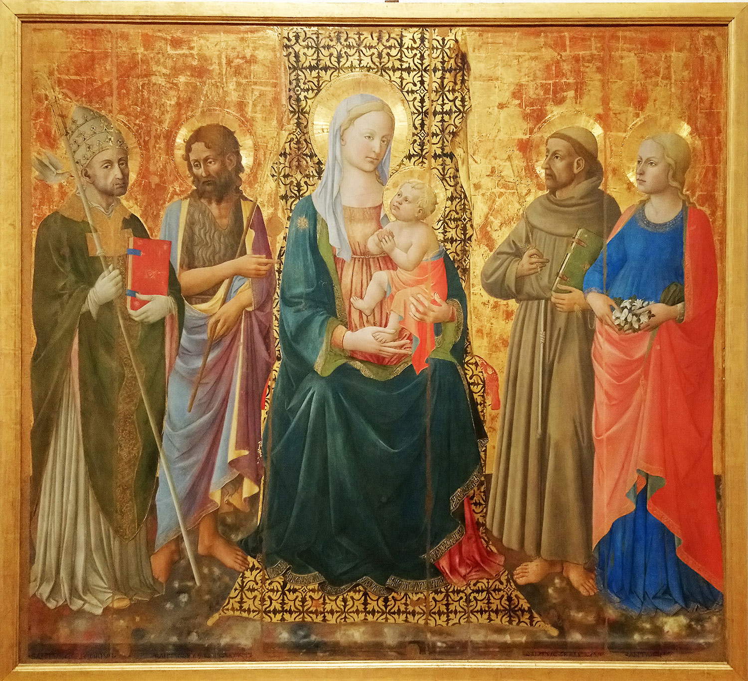 Domenico di Michelino, Madonna and Child with Saints Gregory the Great, John the Baptist, Francis and Fina (1463-1465; tempera on panel; San Gimignano, Civic Museums, Pinacoteca) Domenico di Michelino, Madonna and Child with Saints Gregory the Great, John the Baptist, Francis and Fina (1463-1465; tempera on panel; San Gimignano, Civic Museums, Pinacoteca)