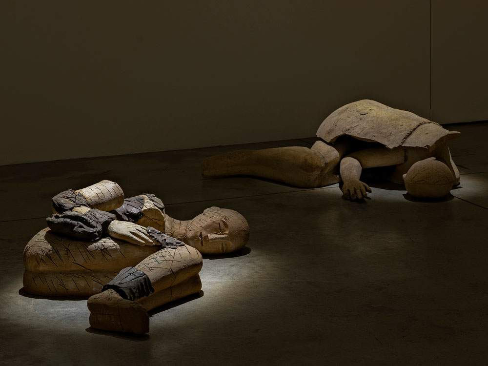 Mimmo Paladino's Sleepers on display in Milan.