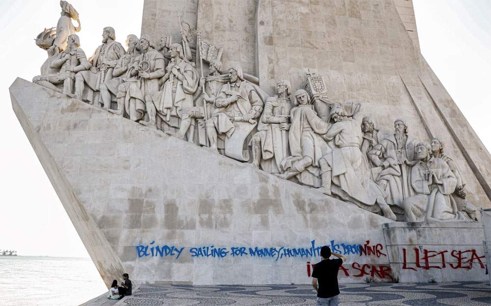 Lisbon, vandalized (and immediately cleaned) the celebrated Monument to the Discoveries