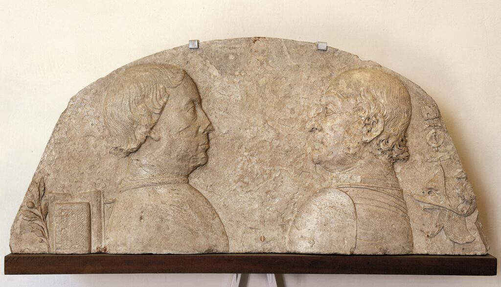 Werkstatt von Ambrogio Barocci, Porträt von Federico da Montefeltro und Ottaviano Ubaldini della Carda (nach 1474; Stein, 50 x 110 x 12 cm; Urbino, Galleria Nazionale delle Marche, Inv. S ) Werkstatt von Ambrogio Barocci, Porträt von Federico da Montefeltro und Ottaviano Ubaldini della Carda (nach 1474; Stein, 50 x 110 x 12 cm; Urbino, Galleria Nazionale delle Marche, Inv. S )