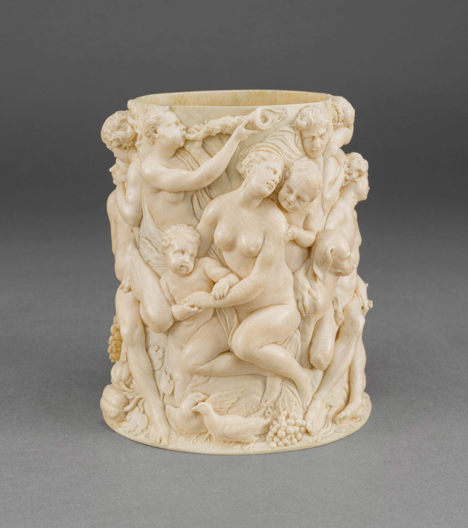 Style of Georg Petel, Cylinder of a tankard with bacchanal Germany Augsburg (mid-17th century; ivory, 15 x 14 x 13 cm; Naples, Museo e Real Bosco di Capodimonte)