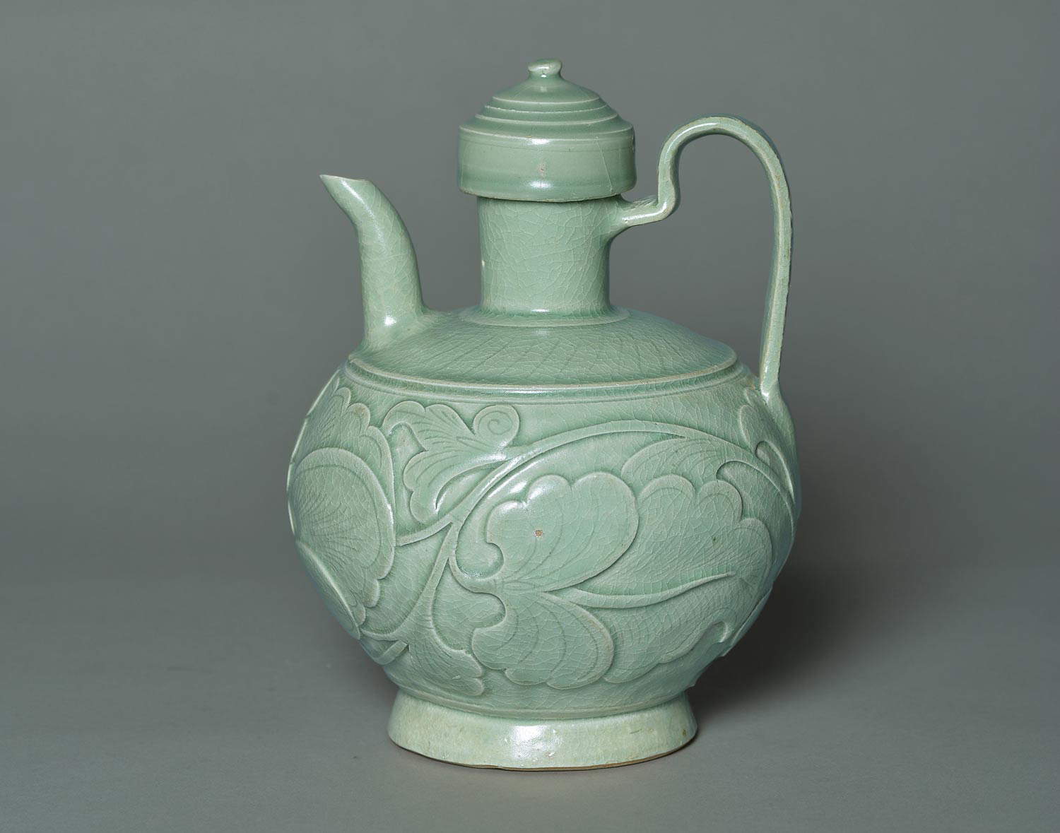 Yaozhou Furnaces, Pitcher with peony motif (Five Dynasties Period - 907-960 - or Northern Song - 960-1127; Stoneware with blue-green glaze, height 21 cm; Shang Shan Tang Collection)
