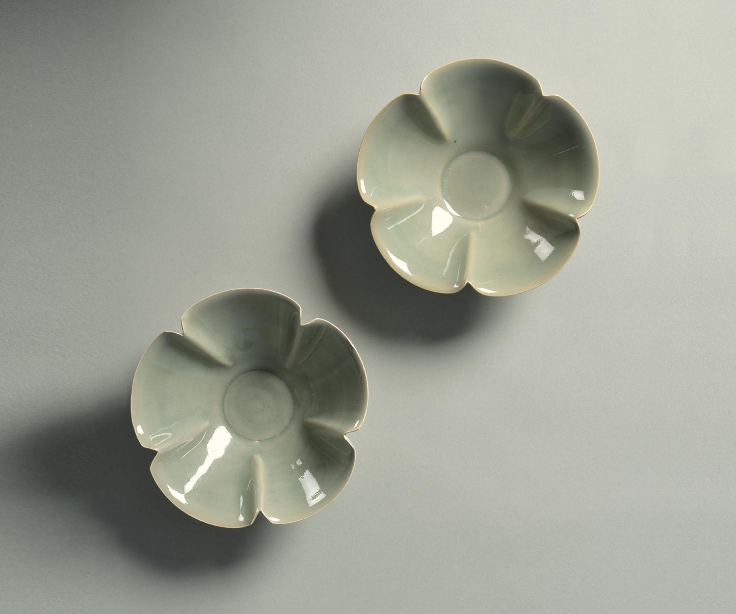 Yaozhou Furnaces, Pair of lobed mugs (Early Northern Song Dynasty - 960-1127; Stoneware with blue-green glaze, diameter 12.8 cm; Shang Shan Tang Collection)