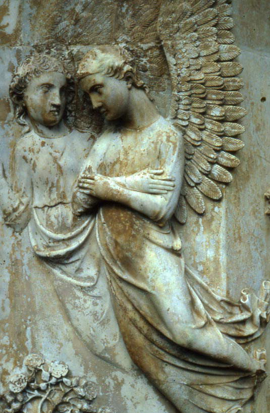 Orvieto, Duomo, detail of two angels in the right pillar of the facade partially covered with layers of yellowish calcium oxalate. Orvieto, Duomo, detail of two angels in the right pillar of the facade partially covered with layers of yellowish calcium oxalate.