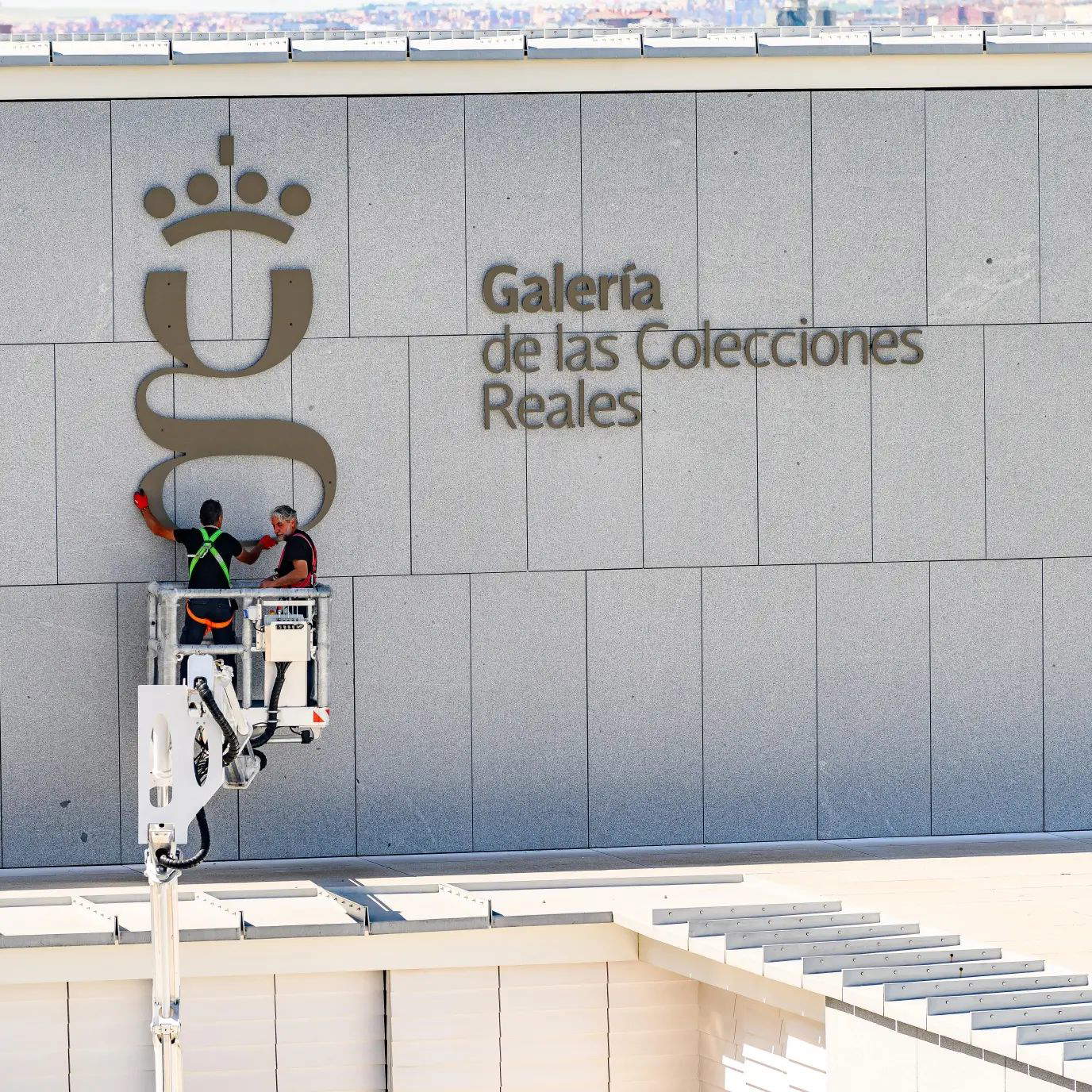 The installation of the logo on the facade The installation of the logo on the facade