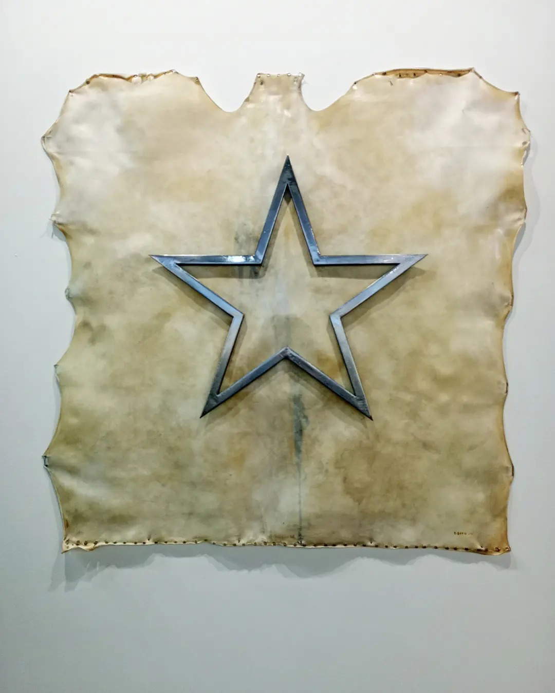 Gilberto Zorio, Memory in Parchment (2021; parchment, steel star, phosphor and black pigment, 160 x 164 x 10 cm). Gilberto Zorio, Memory in Parchment (2021; parchment, steel star, phosphor and black pigment, 160 x 164 x 10 cm).
