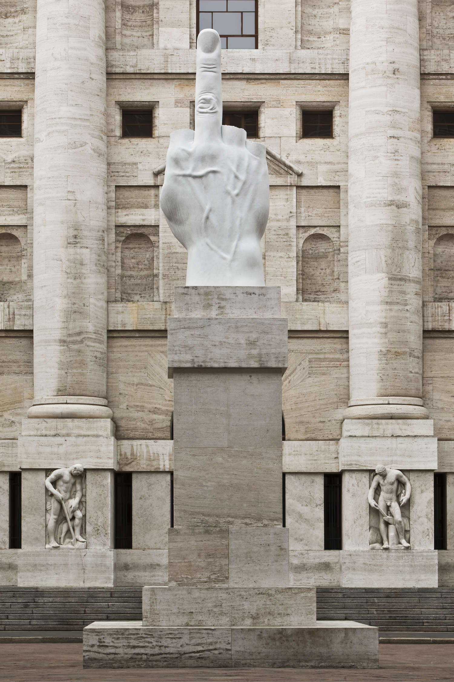Maurizio Cattelan, L.O.V.E. (2010; Carrara marble, 470 x 1100 x 470 cm; Milan, Piazza degli Affari)