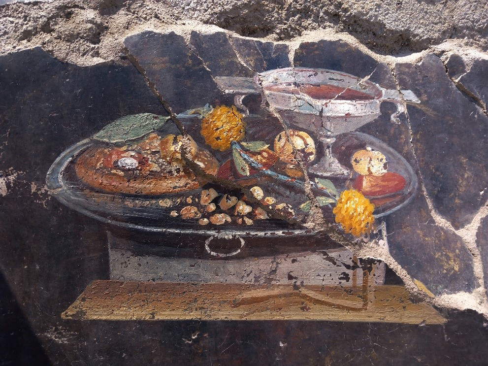 A still life fresco emerges from the Pompeii excavations. Supposedly depicted is a focaccia 