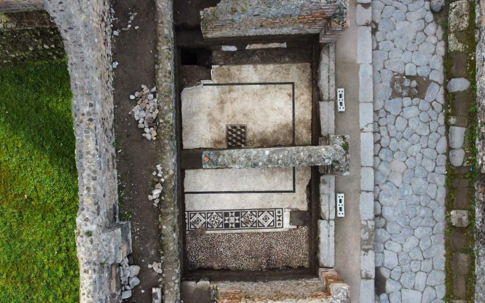 Mosaic floor of an older house emerges at Stabian baths 