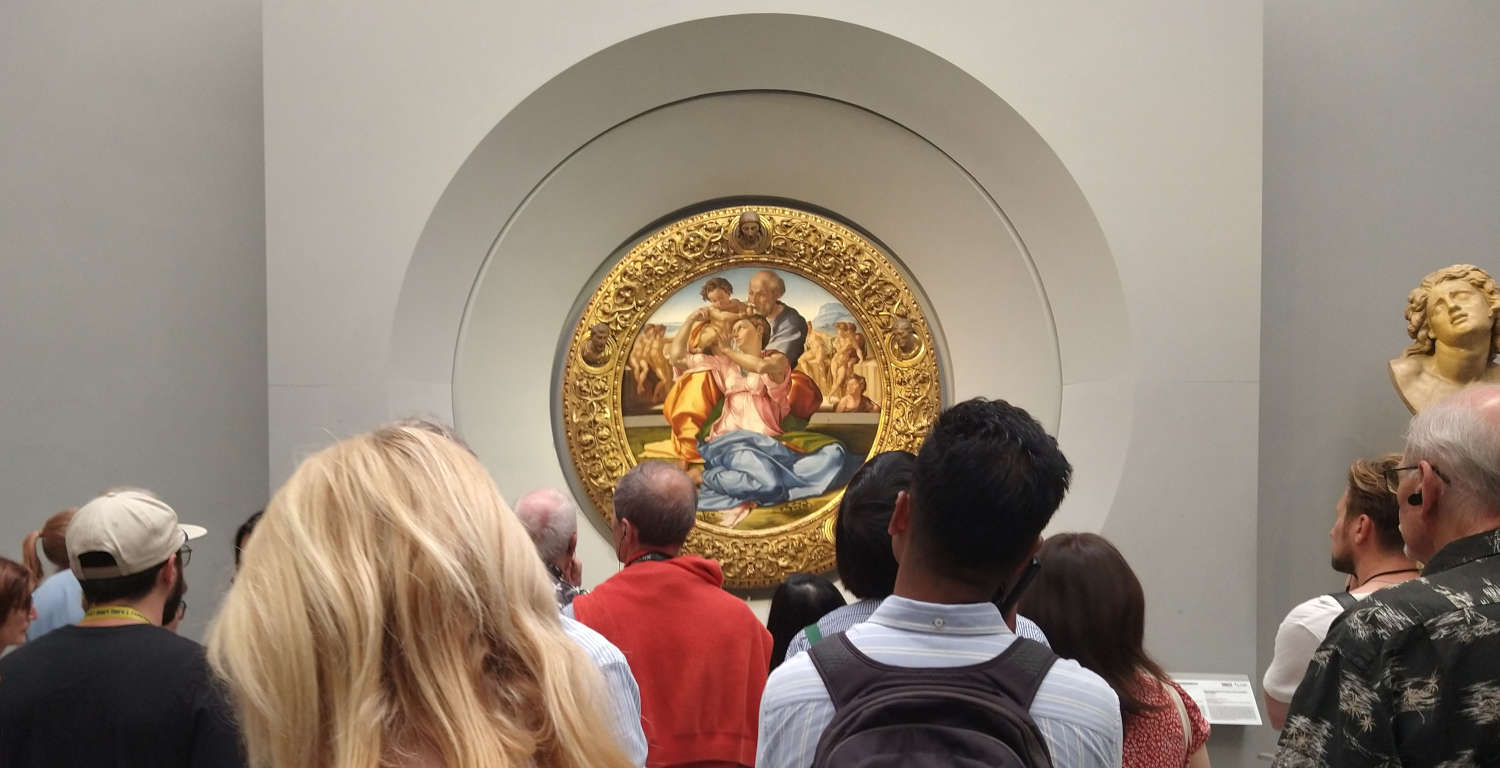 Visitors admire the Tondo Doni at the Uffizi. Visitors admire the Tondo Doni at the Uffizi.
