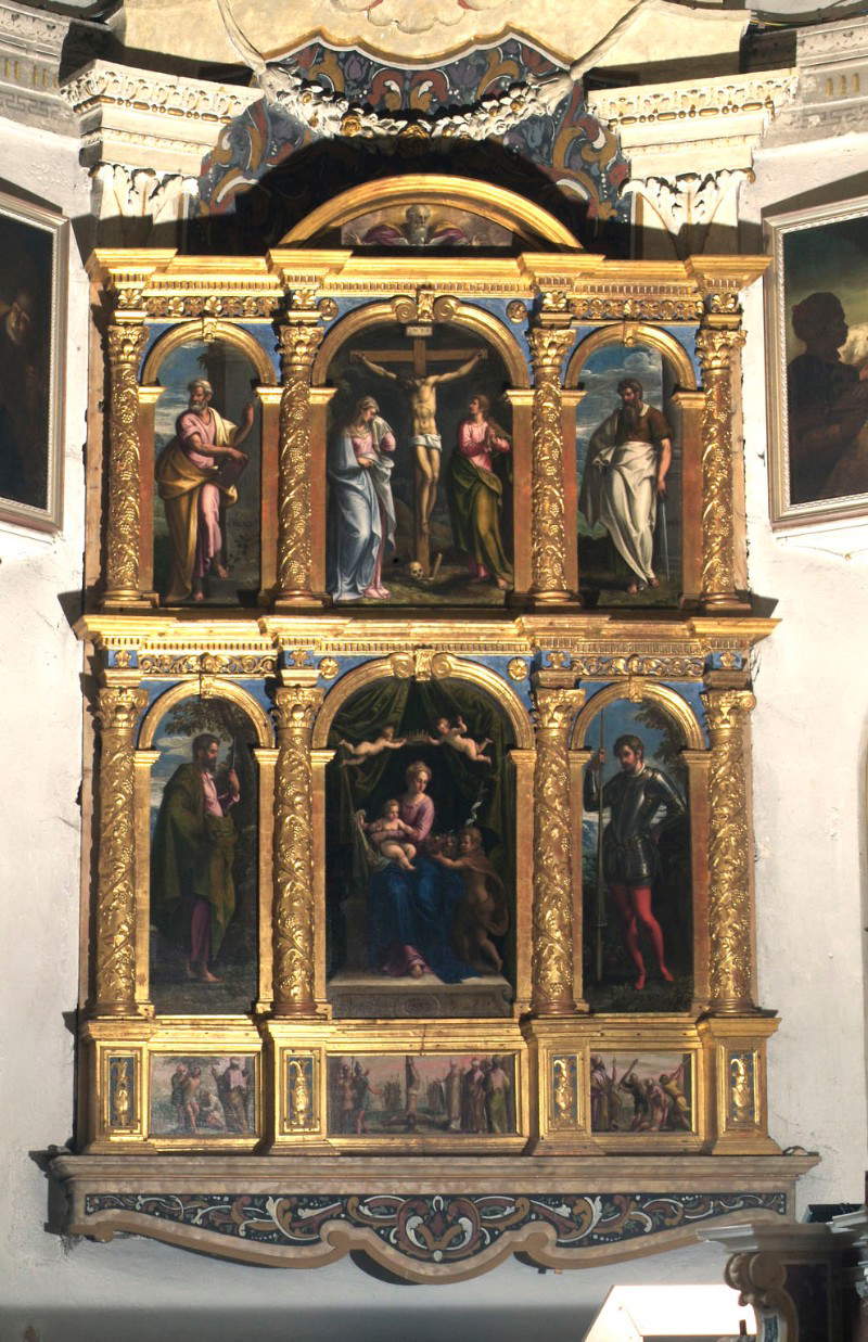 Peintre vénitien, Polyptyque : Vierge à l'enfant avec saint Jean, saint Barthélemy, saint Georges, saint Pierre, saint Paul et la Crucifixion (1587 ; huile sur toile ; Tiarno di Sotto, San Bartolomeo)