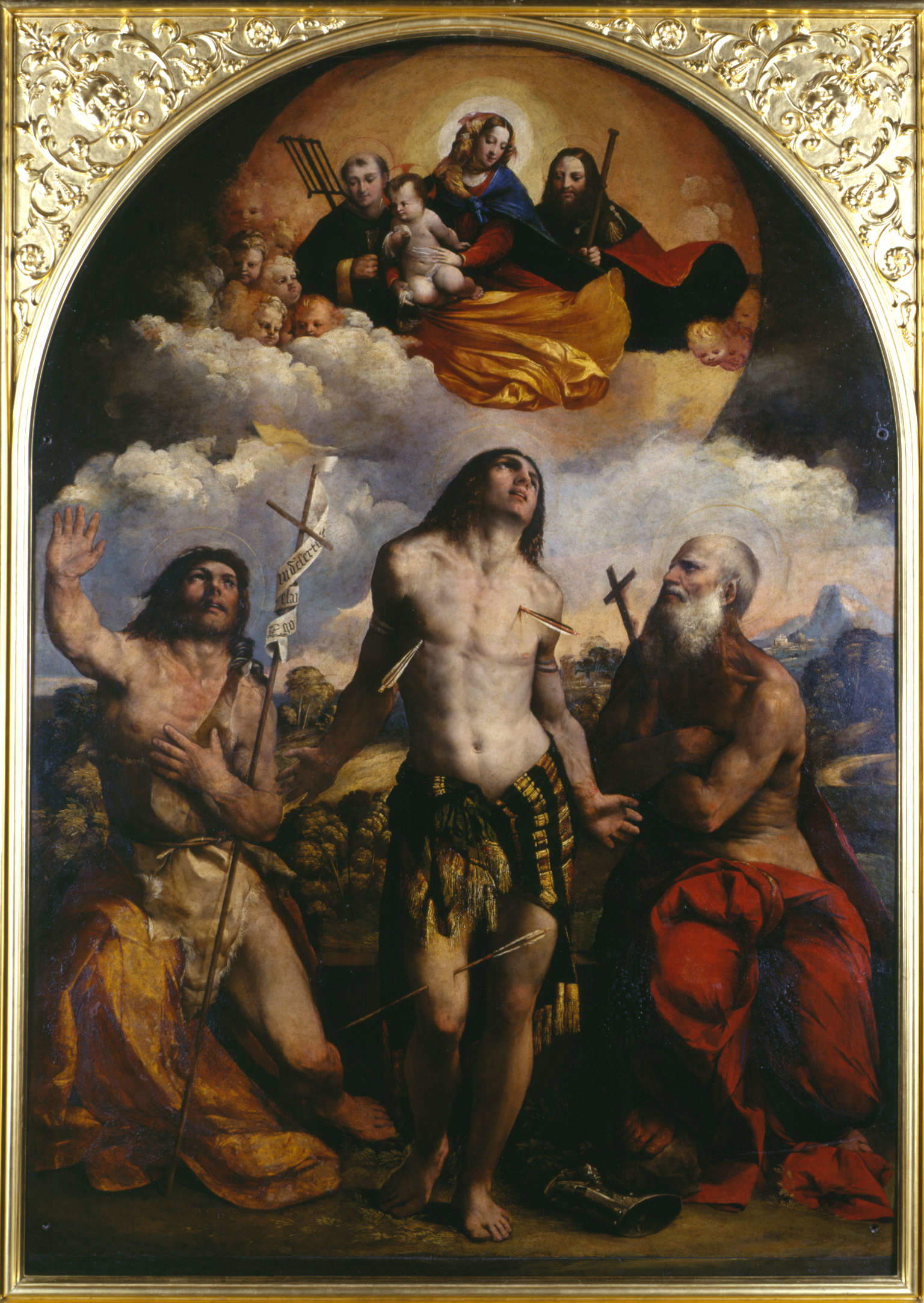 Giovanni Luteri conocido como Dosso, Virgen con el Niño entre los santos Lorenzo, Roque, Juan Bautista, Sebastián y Job, conocida como Virgen de San Sebastián (1518-21; óleo sobre tabla, 272 x 190 cm; Módena, Basílica Metropolitana de Santa María Assunta) Giovanni Luteri conocido como Dosso, Virgen con el Niño entre los santos Lorenzo, Roque, Juan Bautista, Sebastián y Job, conocida como Virgen de San Sebastián (1518-21; óleo sobre tabla, 272 x 190 cm; Módena, Basílica Metropolitana de Santa María Assunta)