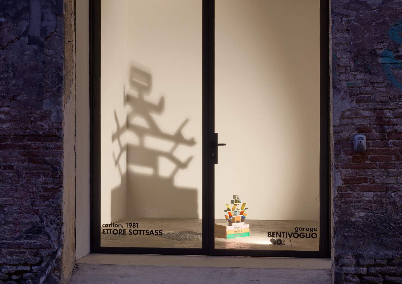 In Bologna, Bentivoglio garage window displays miniature of Ettore Sottsass's Carlton bookstore