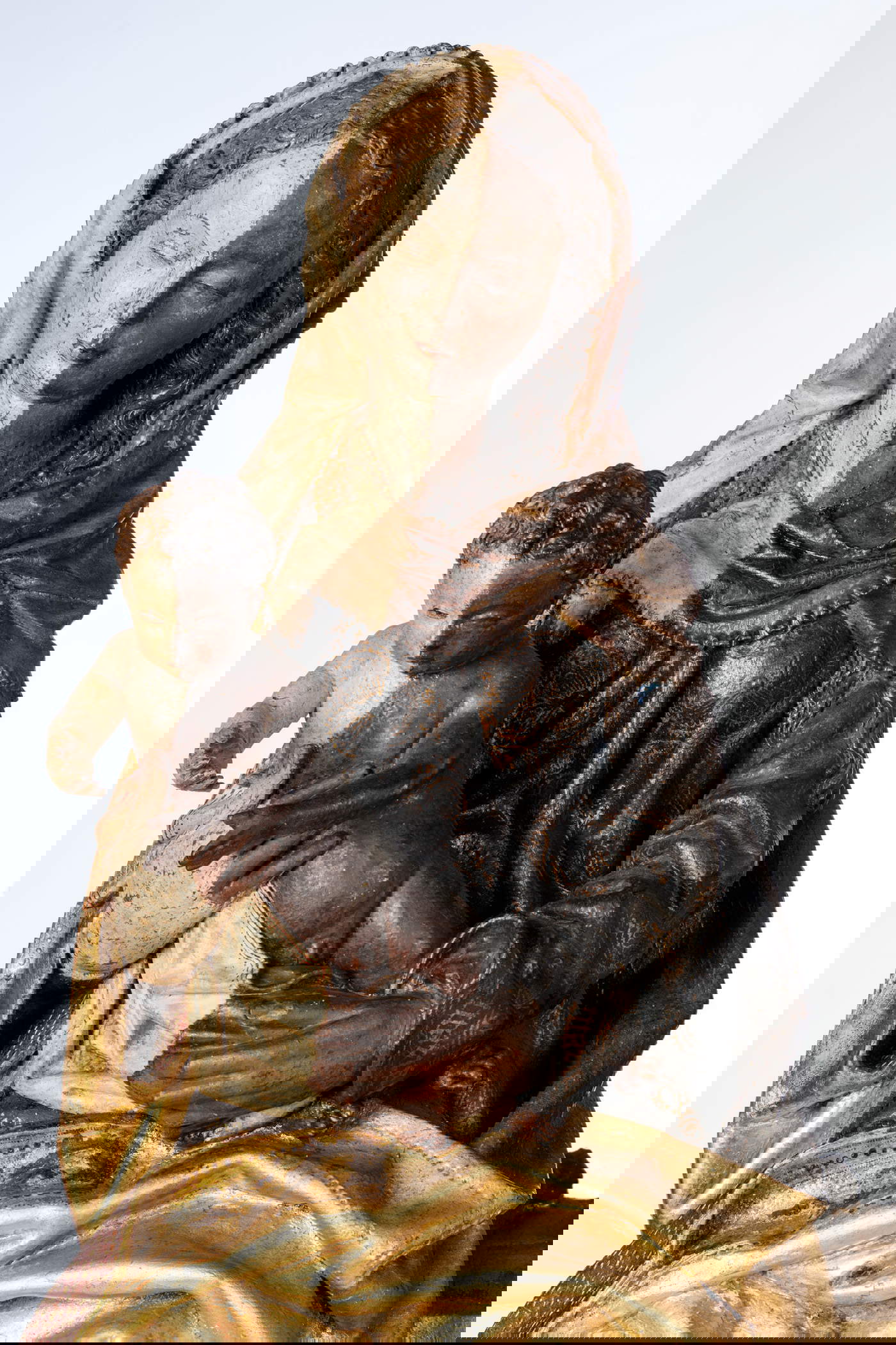 The Virgin and Child before and after restoration