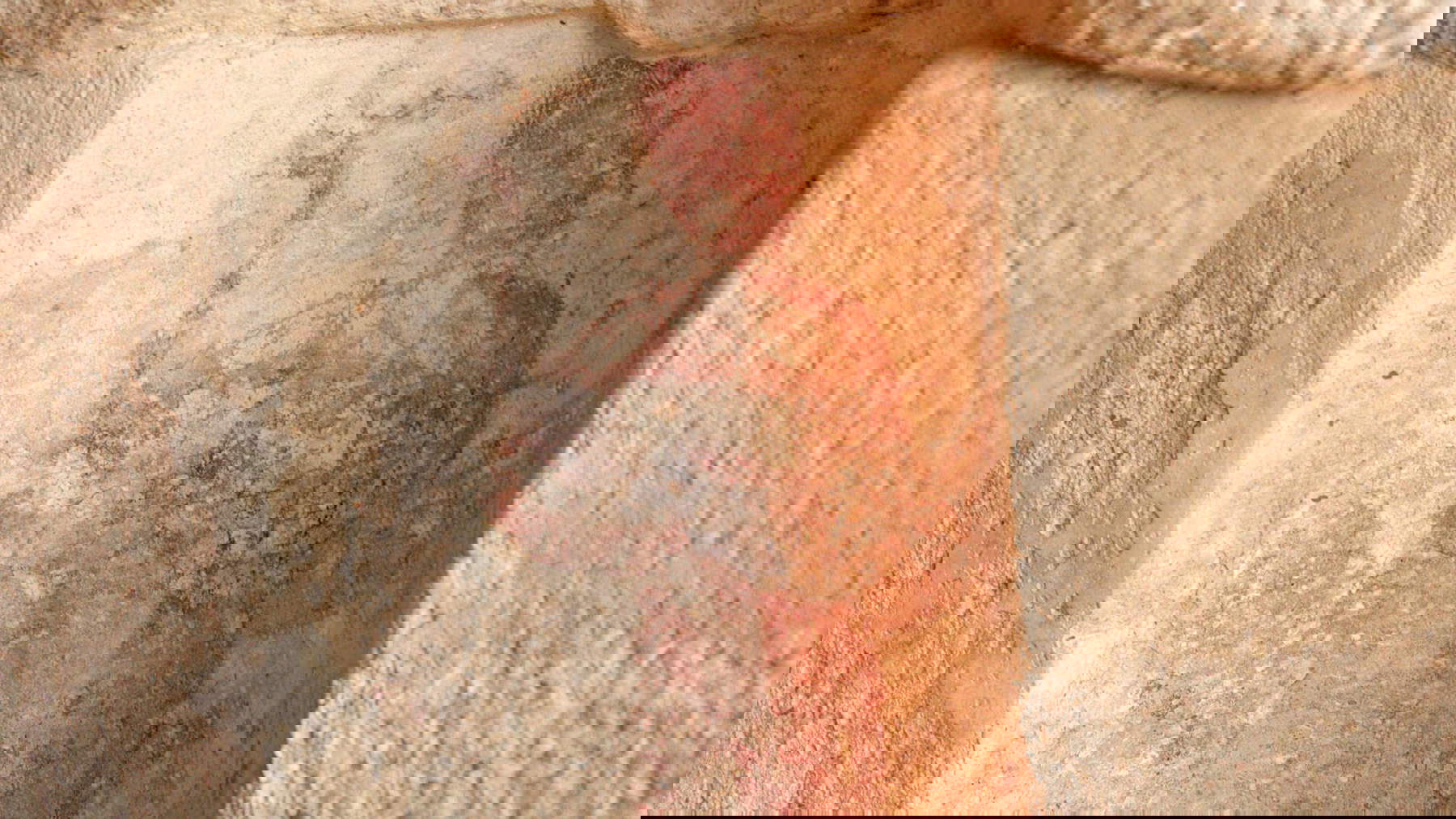 Figure holding a peacock