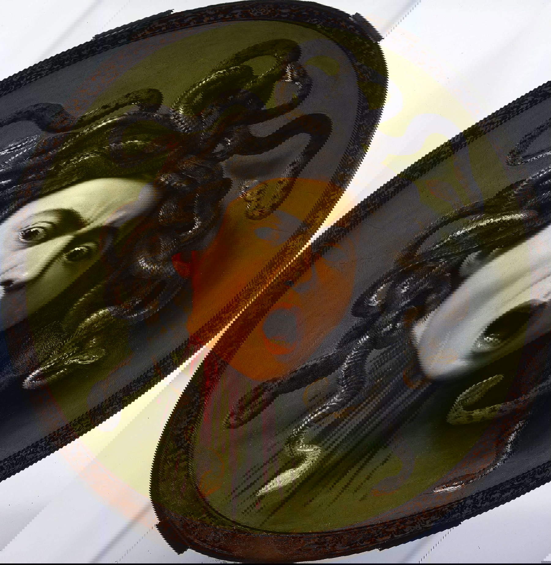 Caravaggio, Medusa (1597-1598; olio su tela, 60 x 55 cm; Firenze, Gallerie degli Uffizi)