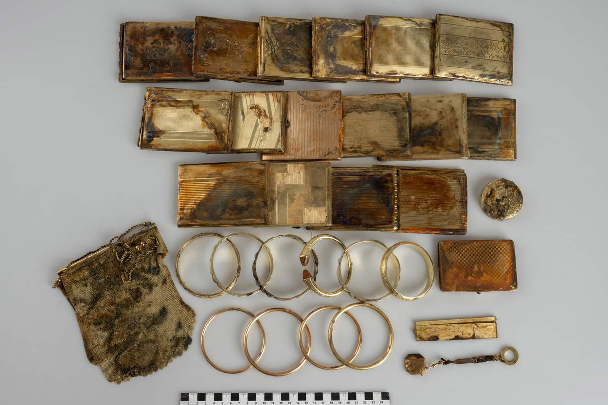 Sixteen cigarette cases and ten bracelets, a thread bag, a comb, a chain, and a dust compact. Credit: Muzeum v&yacute;chodn&iacute;ch Čech Hradec Kr&aacute;lov&eacute;