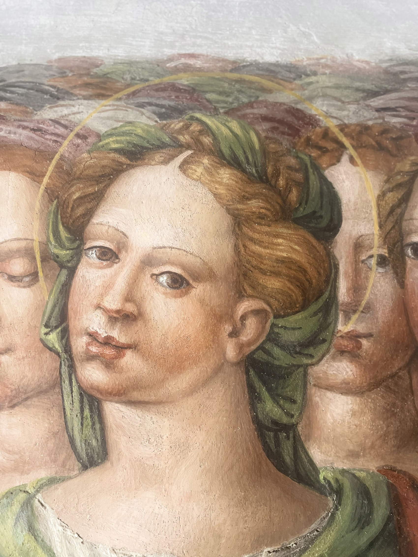 Dettaglio del volto di una delle Vergini Martiri, dopo il restauro.