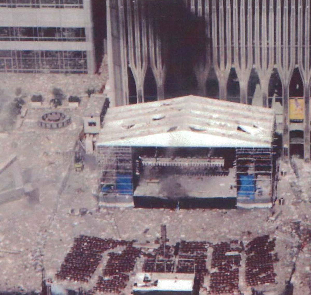 One of the last photographs of the original memorial visible under the Marriott Hotel on the left during the 9/11 attacks. Photo: U.S. government - Wikipedia