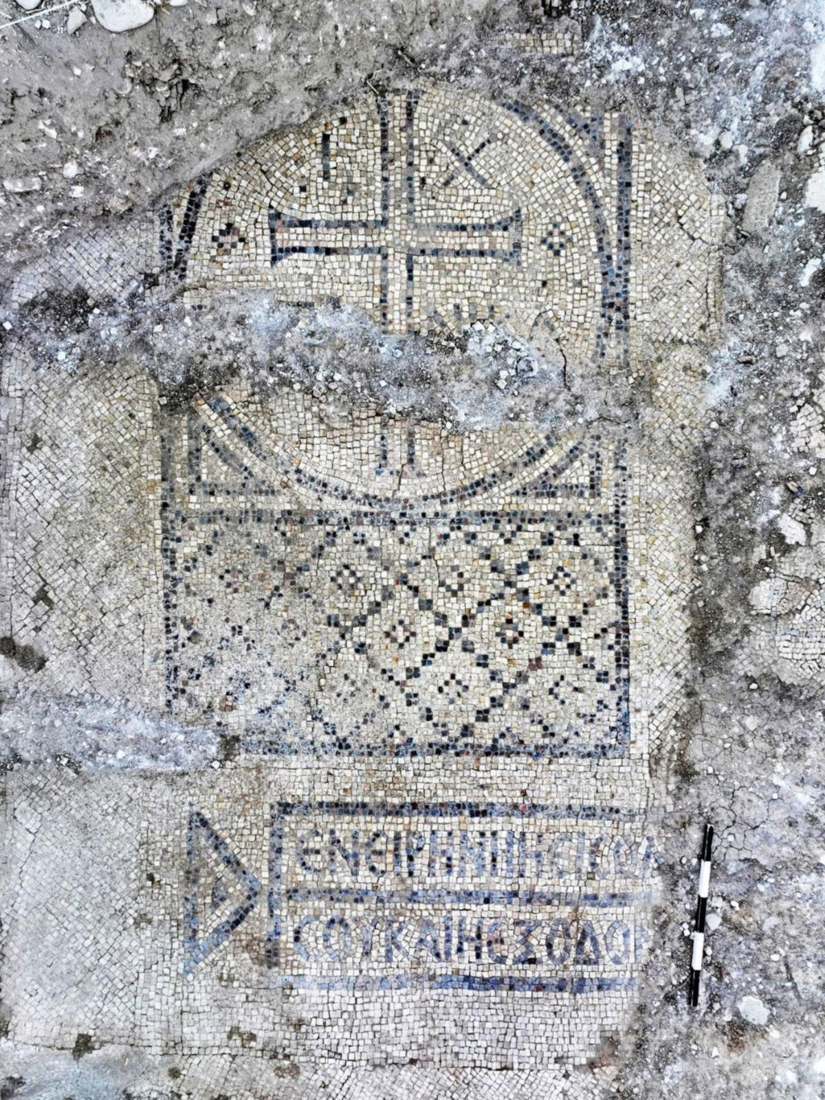 The mosaic with a cross and an inscription in the center. Photo: Emil Eljam, Antiquities Authority