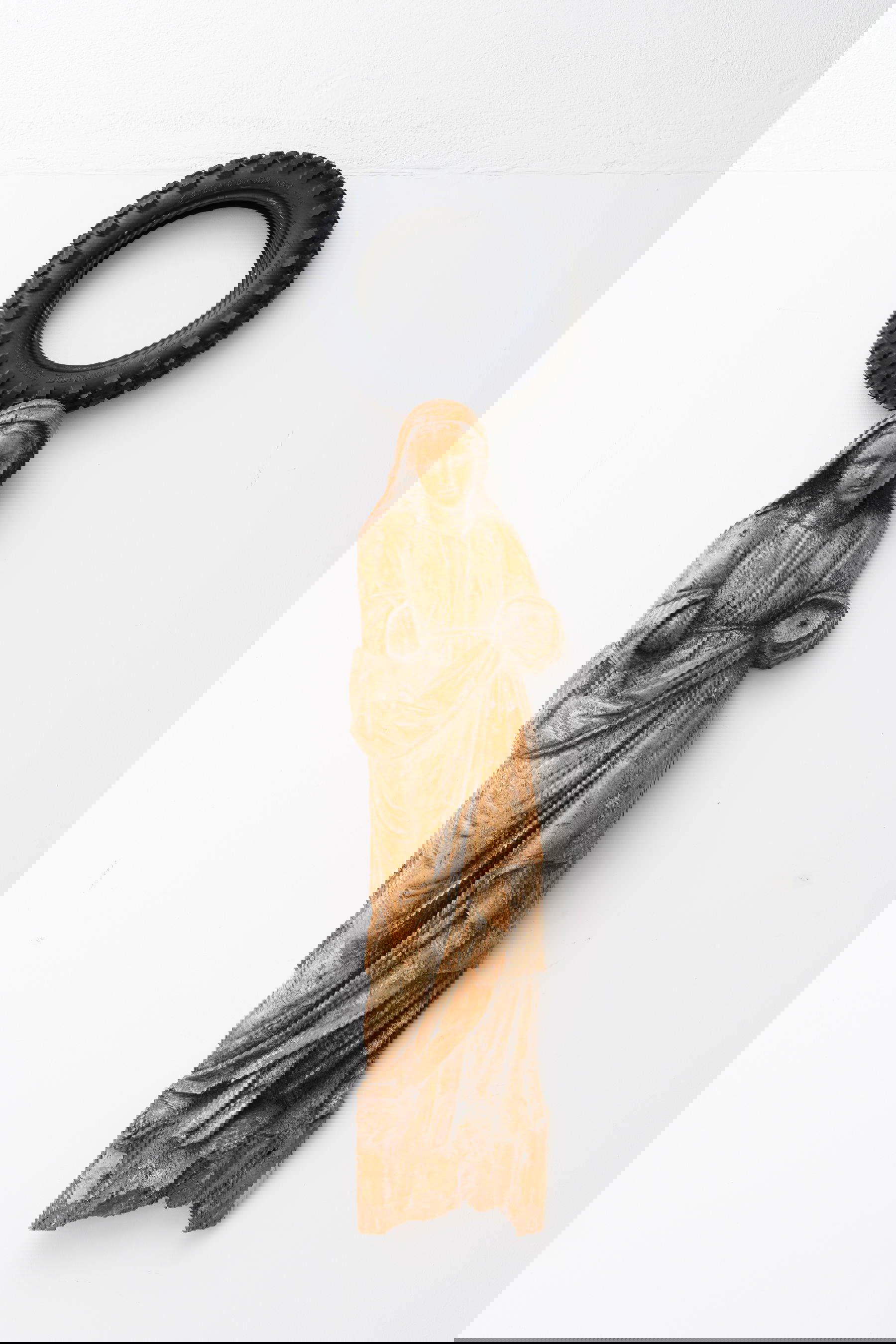 Paolo Canevari, Madonna (1998; wooden sculpture 15th cent. and tire)