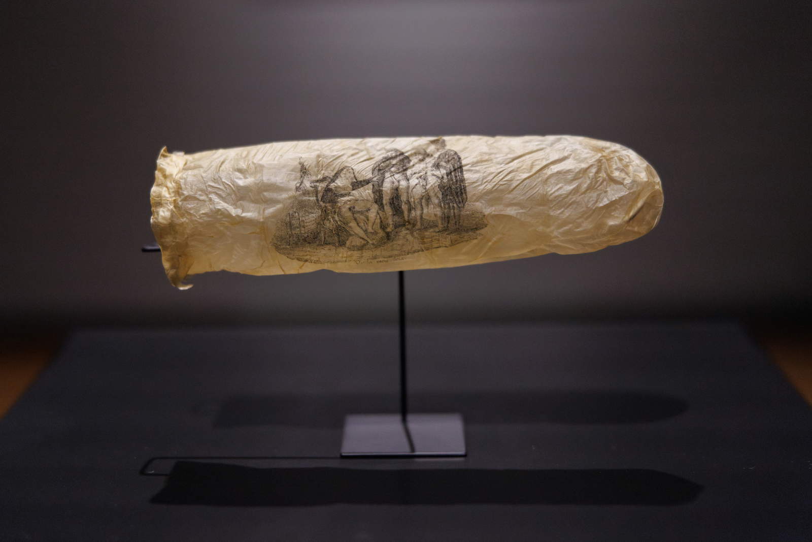 The Rijksmuseum exhibits a rare 1800s condom with erotic printing. Perhaps a souvenir from a brothel
