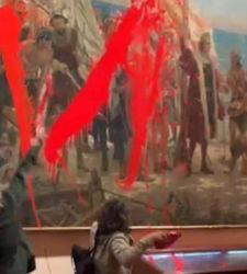 Madrid, activists throw paint at painting not protected by glass