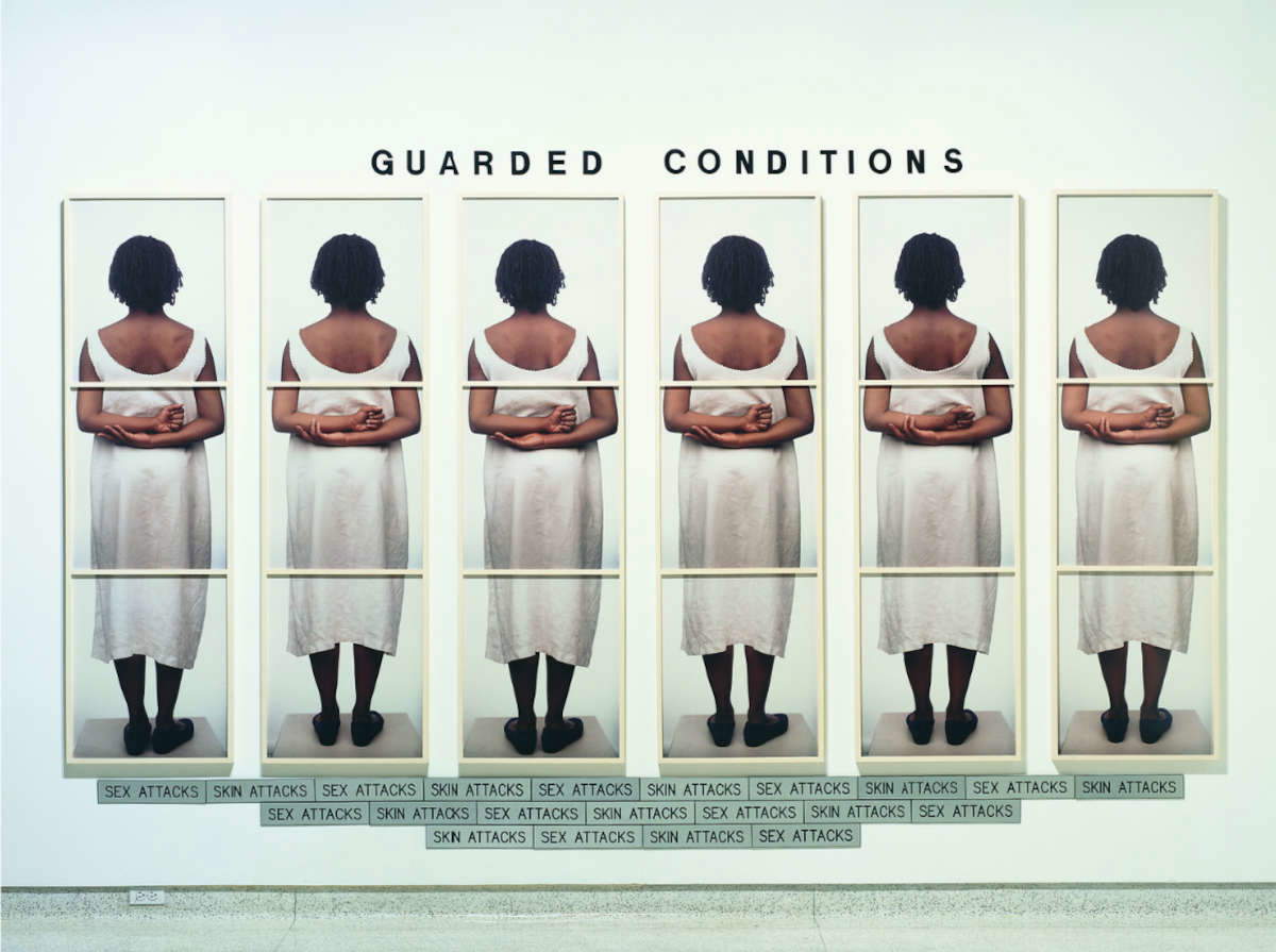 Lorna Simpson, *Guarded Conditions* (1999; 18 color Polaroid prints, 21 engraved plastic plates, and plastic letters; 231.1 x 332.7 cm)
