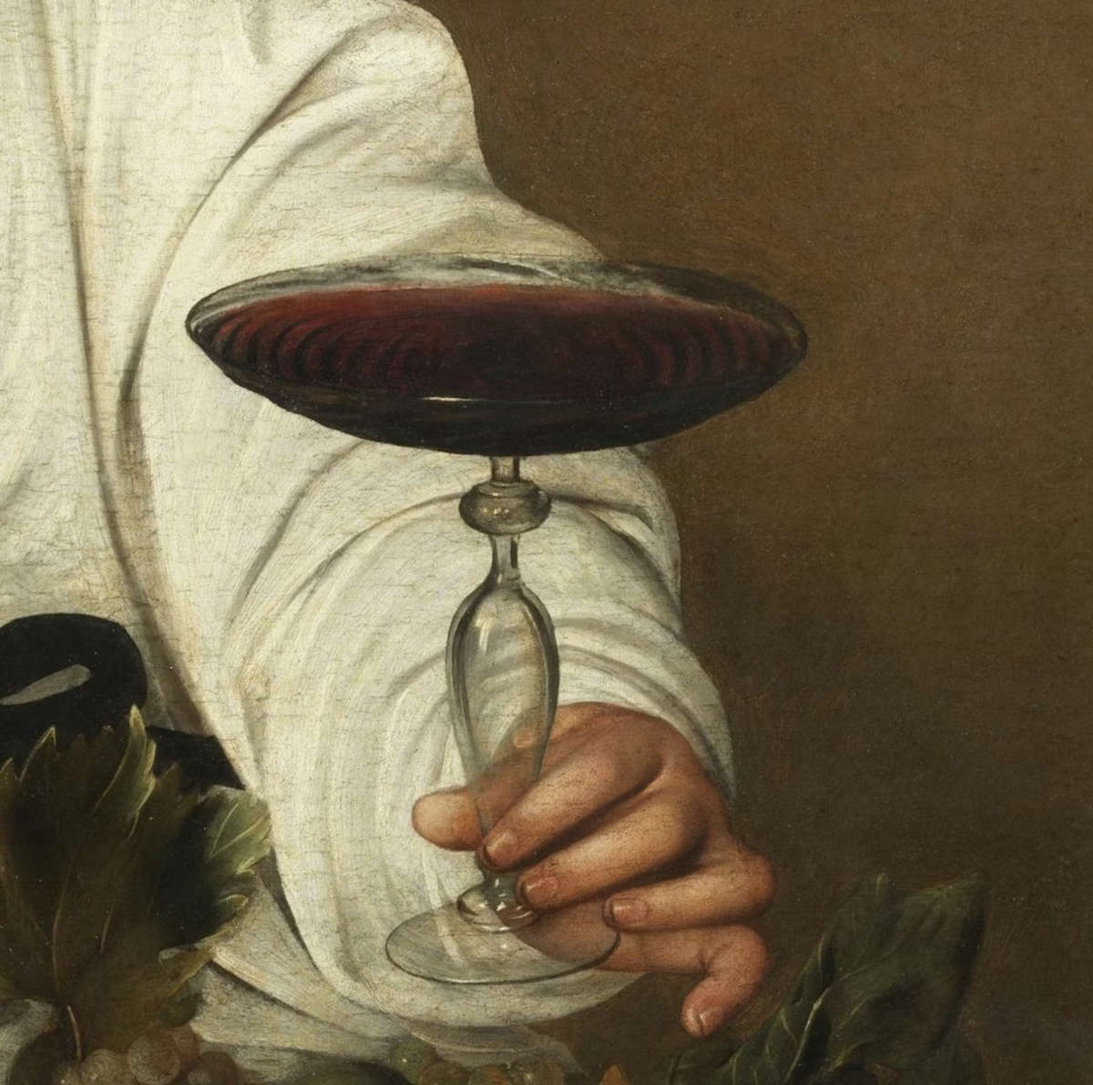 La coppa di vino e la mano