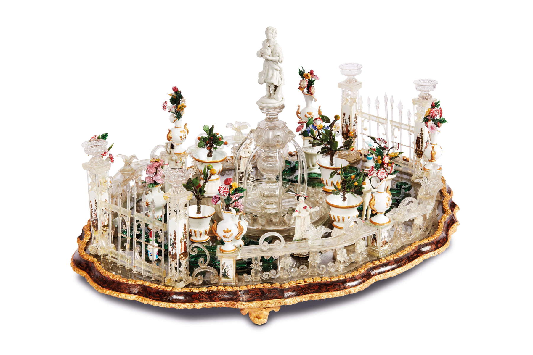 Giuseppe Briati Workshop, “Italian Garden” Centerpiece (Murano, mid-18th century; polychrome blown glass, hand-carved, with engraved and painted decorations; mirror base with lacquered and gilded wooden trim; 33 x 62 x 44 cm). Presented by: Piva &amp; C.