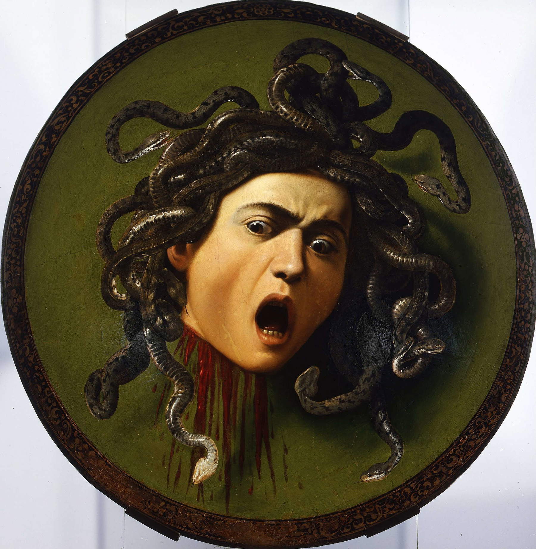 Caravaggio,&nbsp;Medusa&nbsp;(1597-1598; olio su tela applicata su scudo di pioppo, 60 x 55 cm; Firenze, Gallerie degli Uffizi)