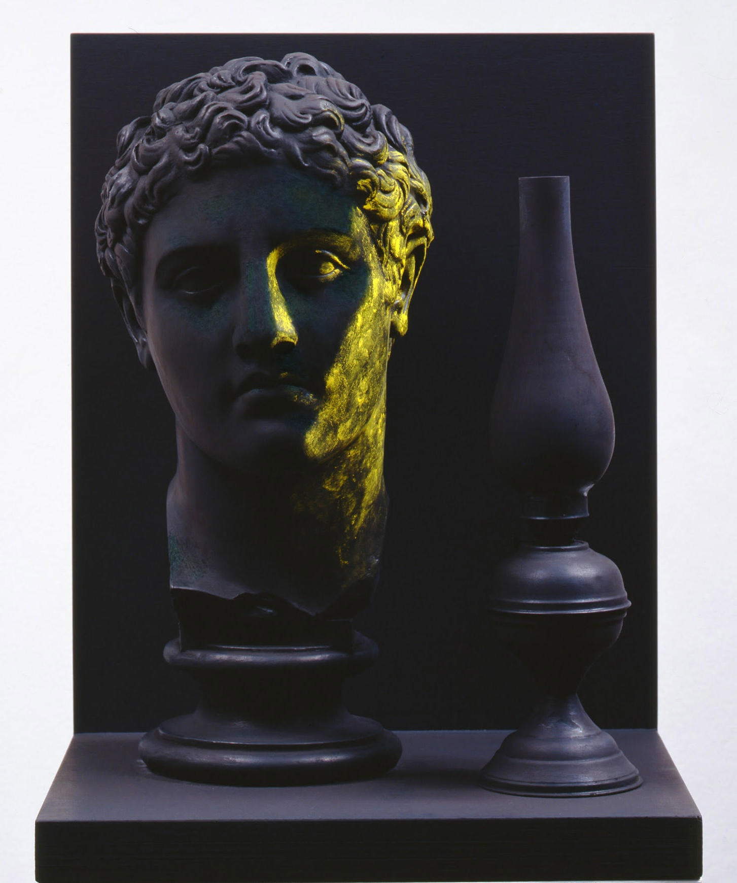 Claudio Parmiggiani, A lume spento (1985; acrylic and pigment/chalk plaster, oil lamp and painted wood, 54 x 41 x 32 cm) Courtesy of Tornabuoni Art