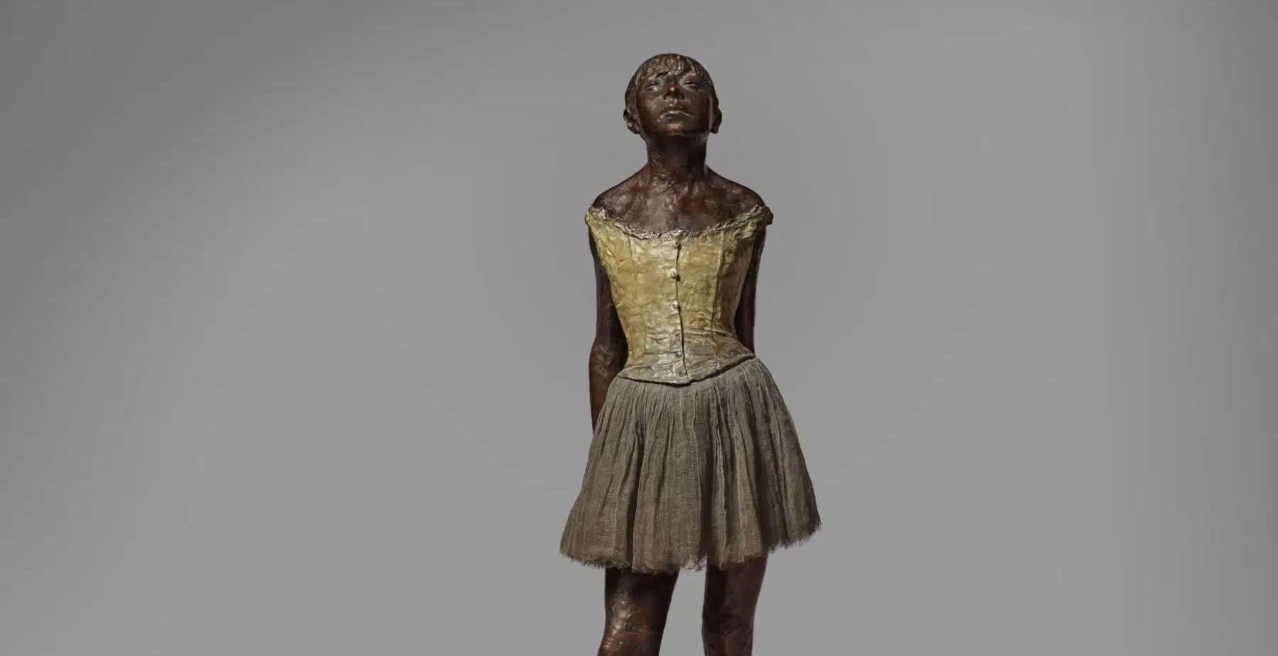 Edgar Degas, Petite danseuse de quatorze ans (1922; bronze with muslin skirt and satin ribbon in her hair, on wooden base, 101.3 cm) Photo: &copy; Sotheby's