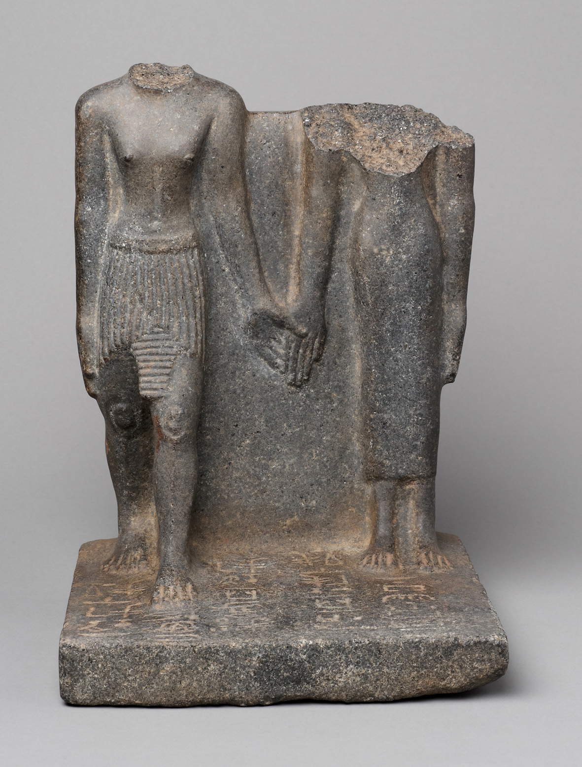 Statuary group of Nefer-heb and Dedet-nebu (Second Intermediate Period, c. 1700-1650 BCE; basalt; Vienna, Kunsthistorisches Museum, East Egyptian Collection) &copy; KHM-Museumsverband
