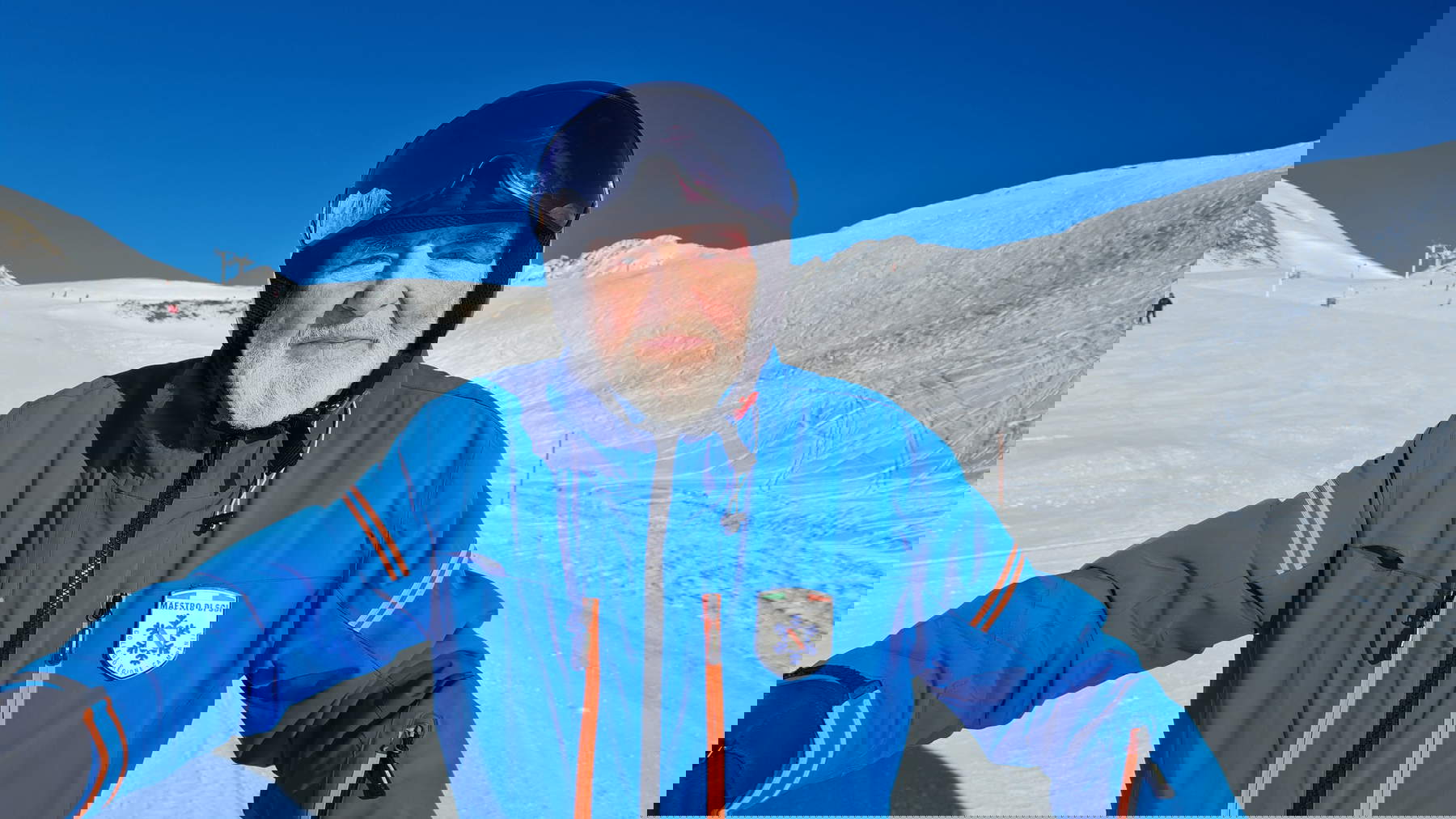 Michelangelo Pistoletto in a blue ski suit. Photo from Michelangelo Pistoletto's Instagram profile.