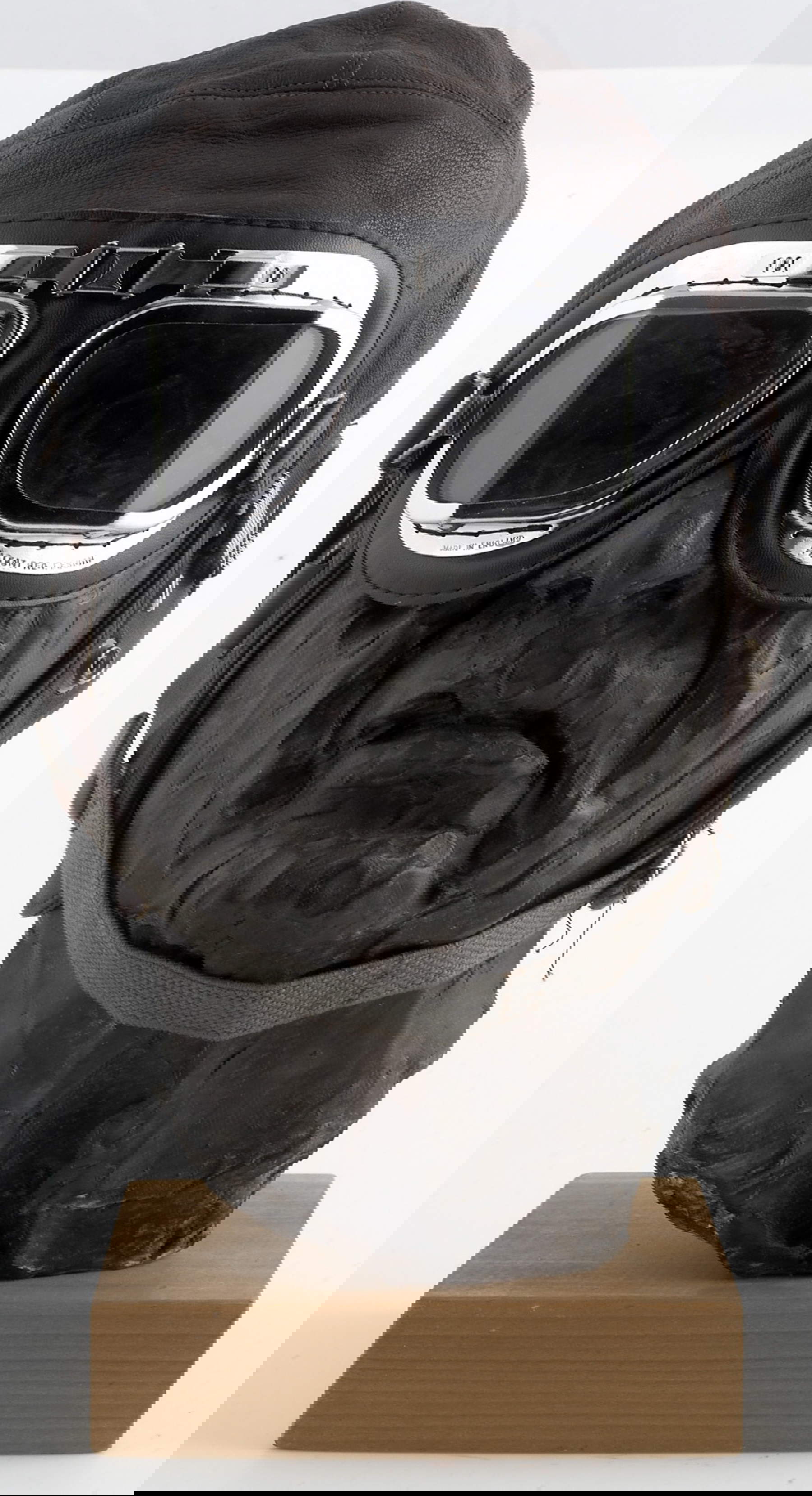 Mimmo Rotella, Self-Portrait (q.d.; bronze, glasses, leather cap, 40 x 20 x 20 cm). Courtesy of Mimmo Rotella Foundation.