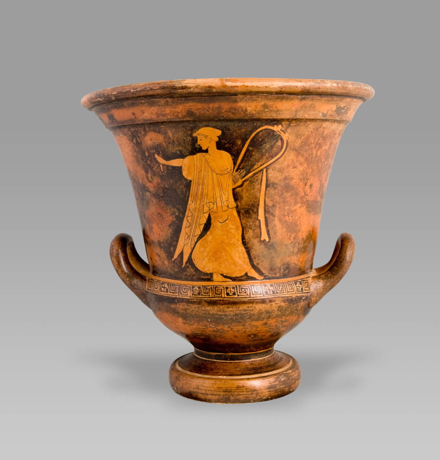 A red-figure goblet-shaped krater attributed to the Painter of Tithonus, depicting Sappho, identified by the name appearing on the vase (480–470 B.C.). Courtesy of Kunstsammlungen Antike der Ruhr-Universit&auml;t Bochum, S 508. Photo: Michael Benecke