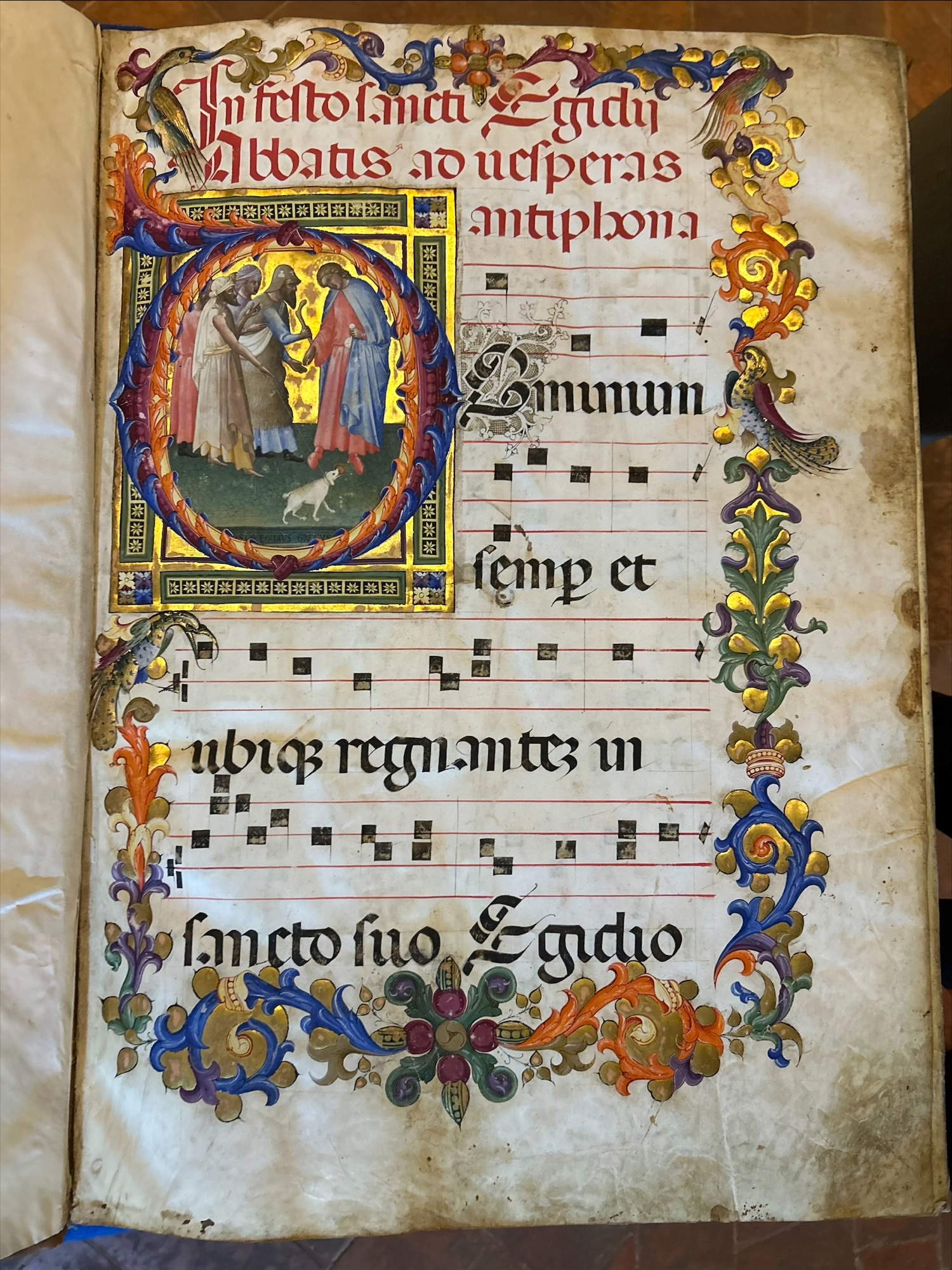 Museo di San Marco, Antiphonary of St. Egidius, Bartolomeo di Fruosino, Initial D - St. Egidius gives alms to the poor, including a blind man with his dog-guide, c 2 r, 1421 &copy; MiC - Regional Directorate National Museums Tuscany - Museo di San Marco