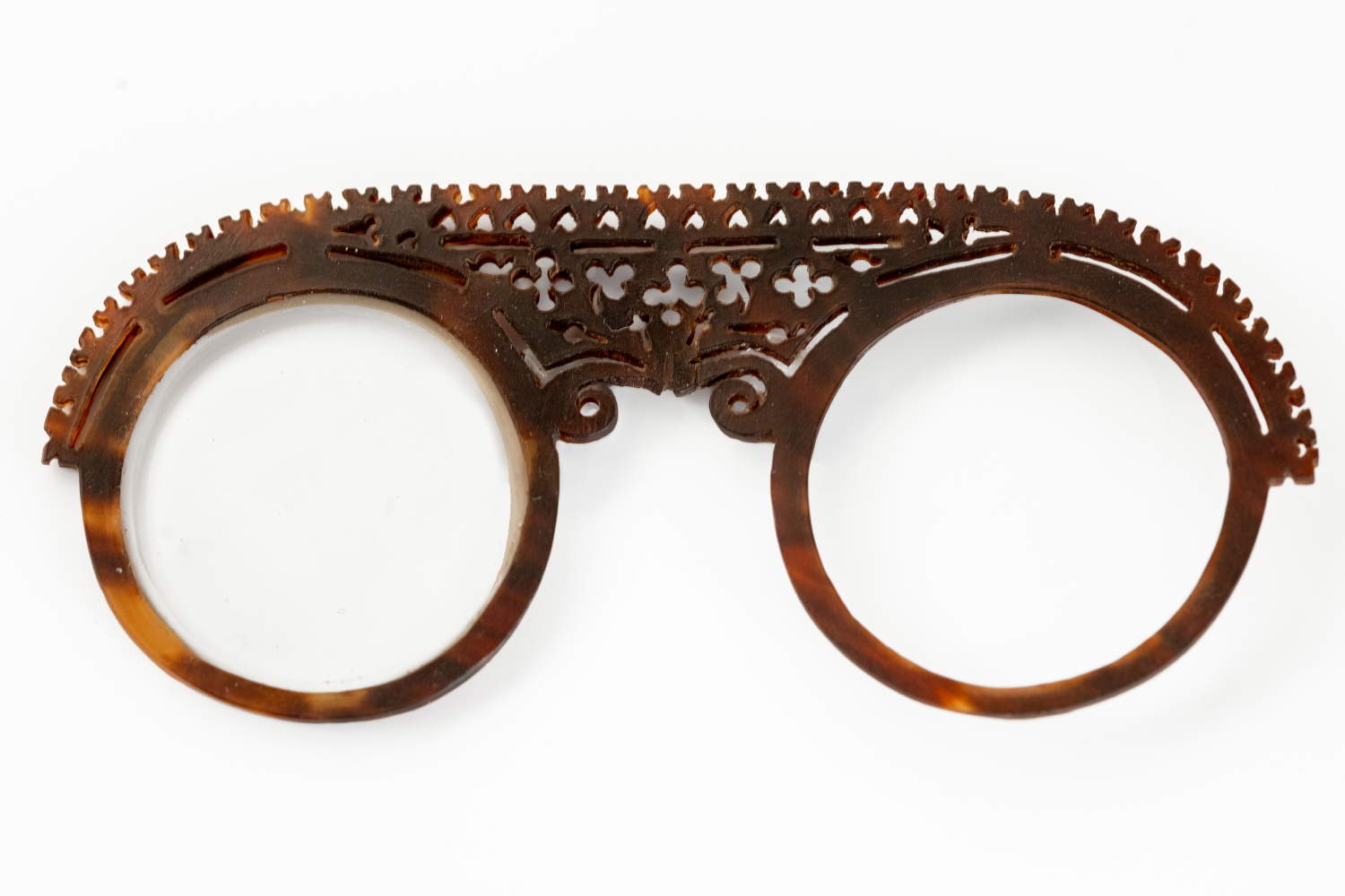 A rare pair of Nuremberg tortoiseshell spectacles, dating from the late 17th century and featuring an elaborate and elegant openwork design on the bridge. From the Eyewear Museum collection.