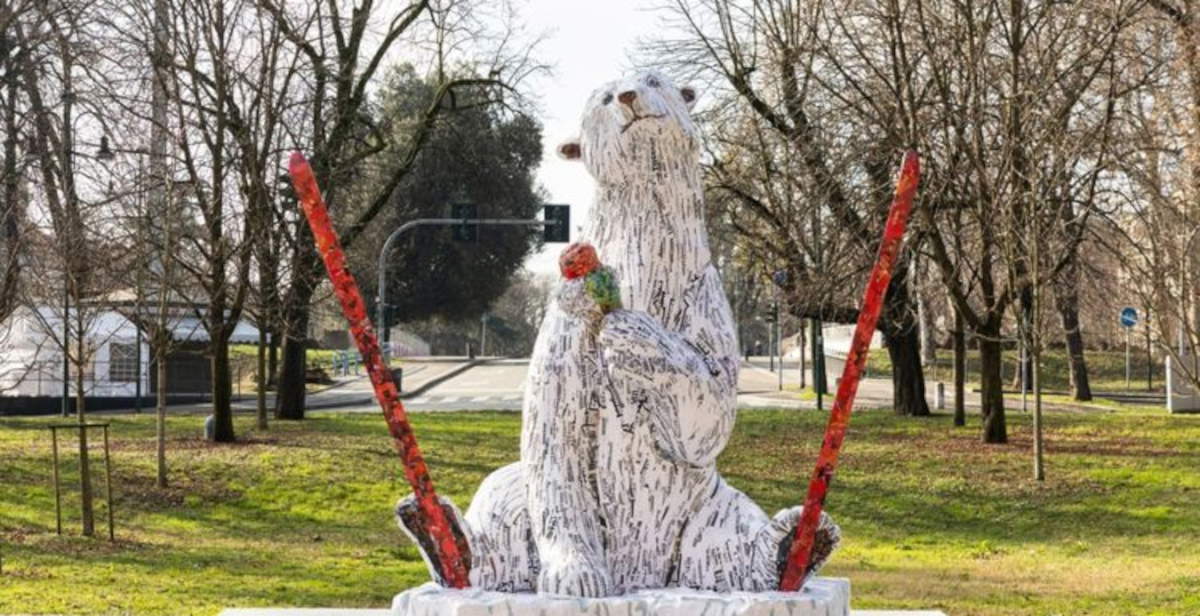 A paper mache polar bear welcomes Milan Cortina 2026 at the Triennale