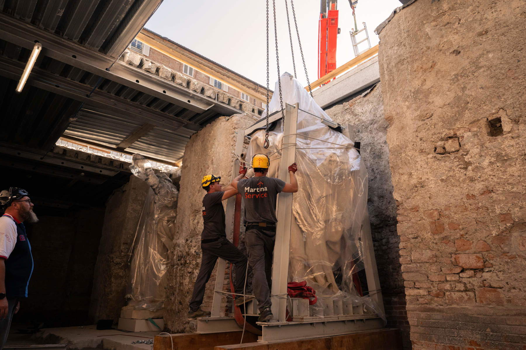 The four large allegorical statues are being placed in the Carlo Emanuele I Gallery of Palazzo Madama. Photo: Alessio Bergadano