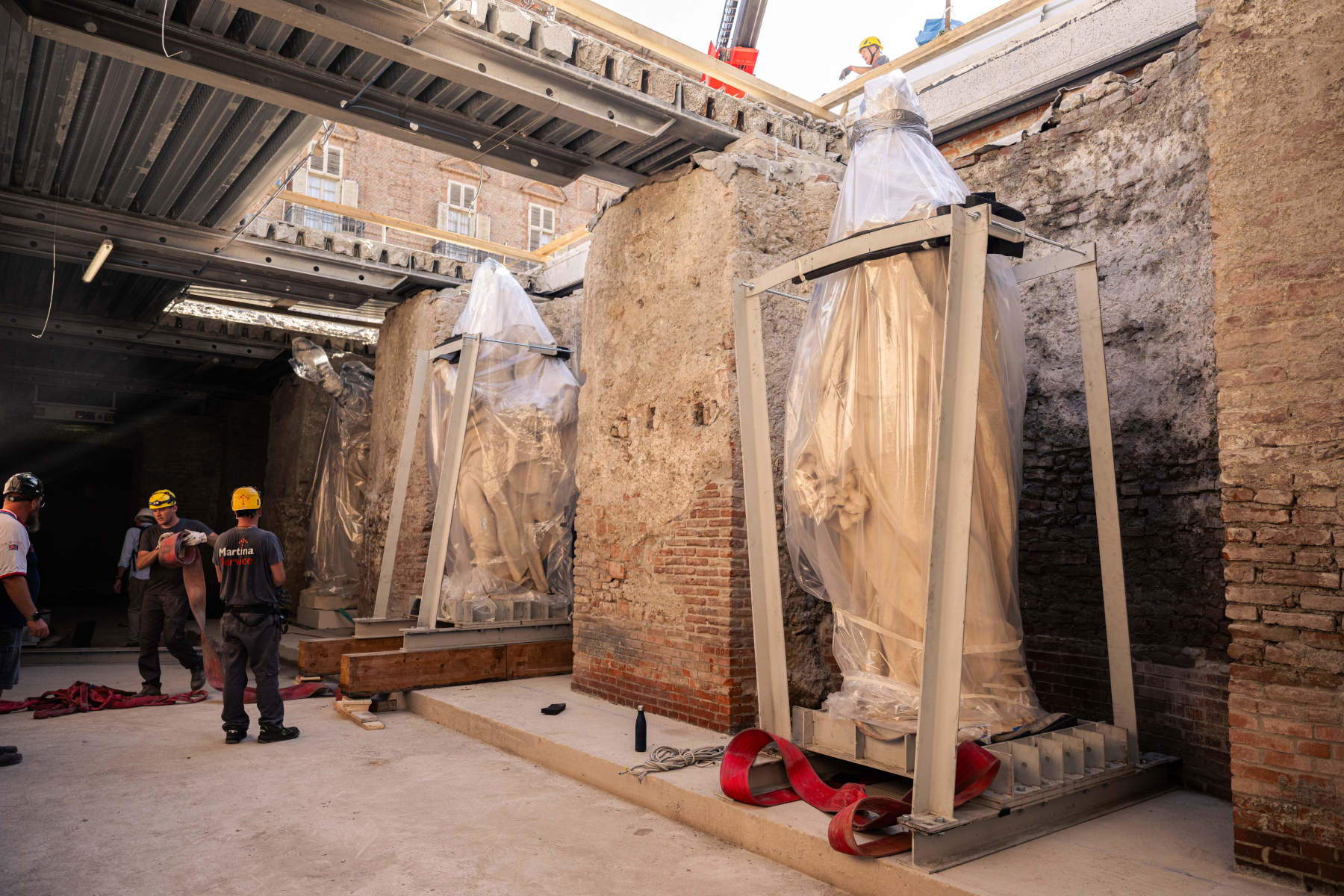 The four large allegorical statues are being placed in the Carlo Emanuele I Gallery of Palazzo Madama. Photo: Alessio Bergadano