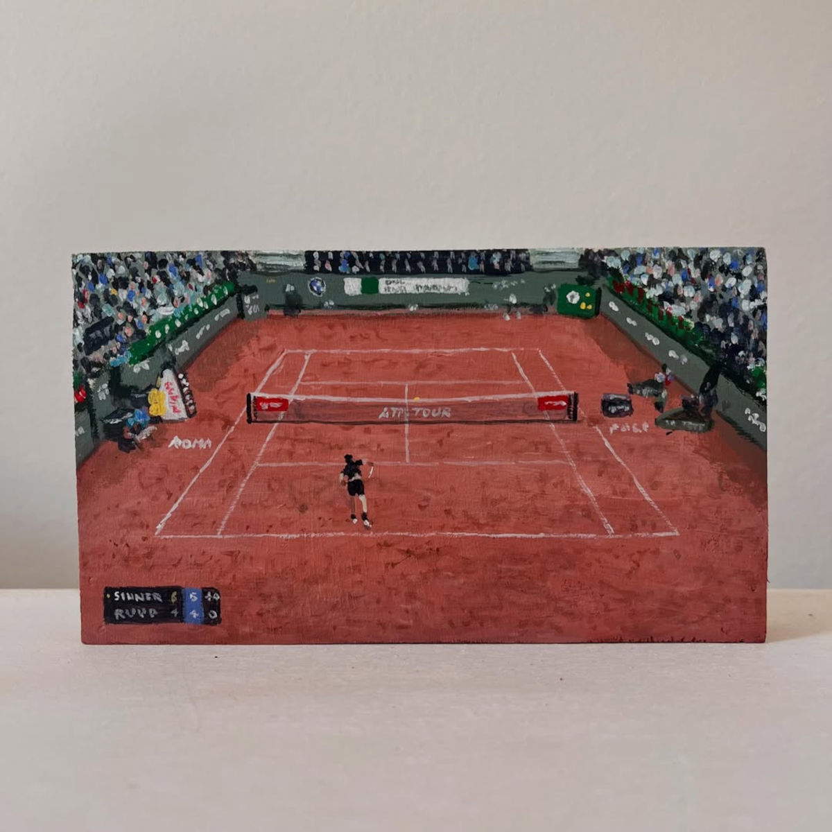 Simone Tribuiani, Finale Internazionali d'Italia Sinner vs Ruud 2026 (2026; acrylic on wood panel, 15.5 x 8.8 cm) Photo: Instagram - Simone Tribuiani